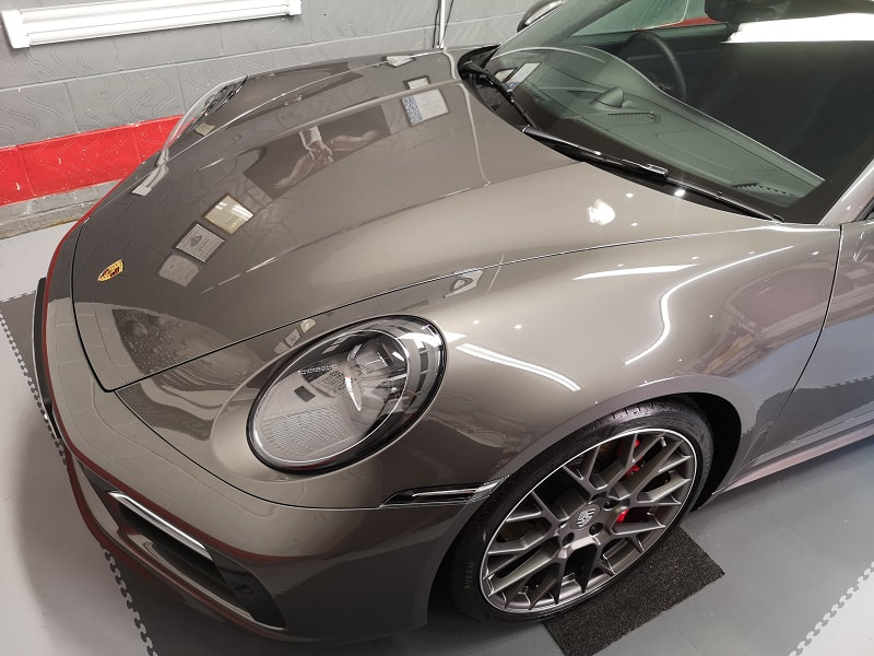 A professionally detailed Porsche 911 with ceramic coating protection.