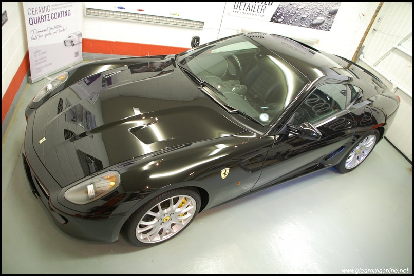 Black Ferrari 599 parked in car detailing studio at gleammachine detailing