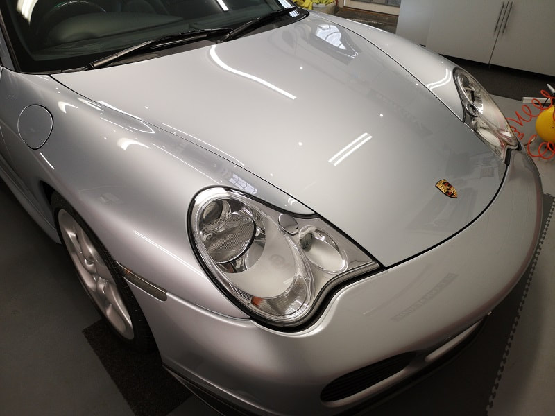 Silver porsche bonnet recently machine polished and ceramic coated.