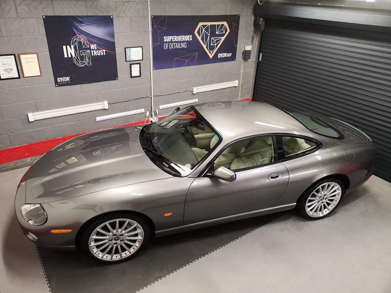 Grey Jaguar XK8 car in studio